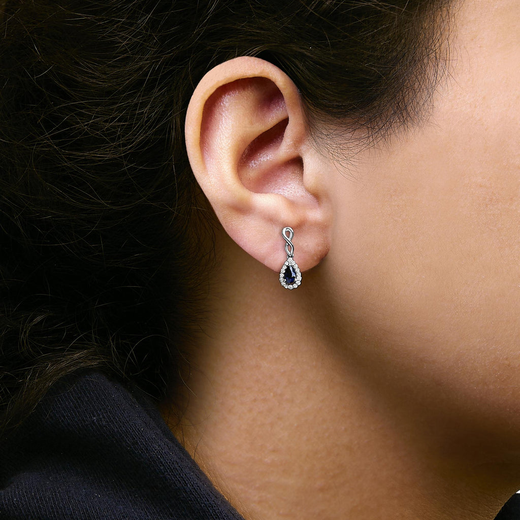 10K White Gold Pear Cut Blue Sapphire and 1/7 Cttw Diamond Infinity Drop and Dangle Earrings (I-J Color, I1-I2 Clarity)