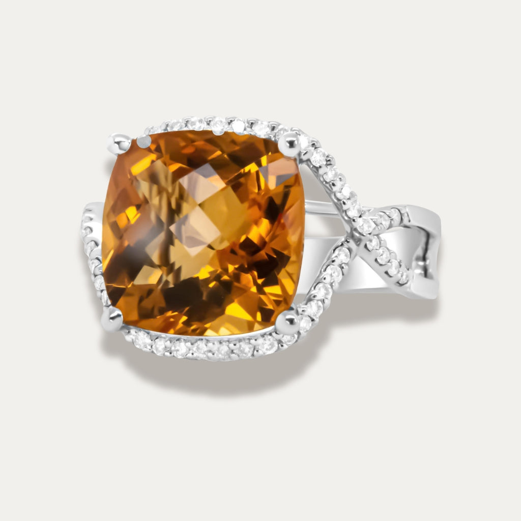 14K White gold ring with a large yellow citrine gemstone on a light grey background