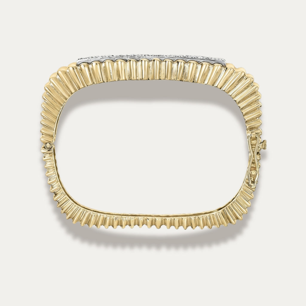 Gold diamond  bracelet on a light gray background