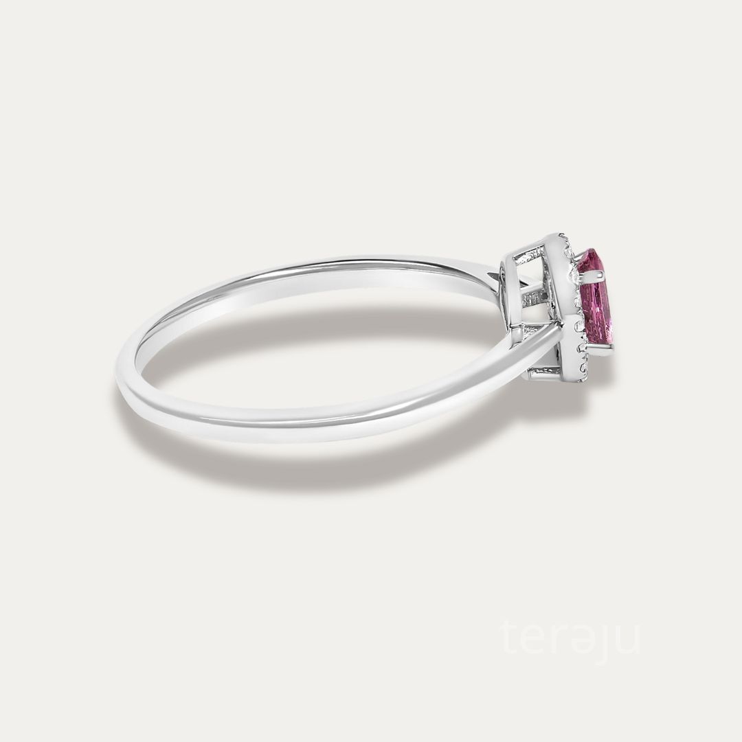 Side view of the Origine birthstone halo ring in 10K white gold showing the raised halo setting above the slim band